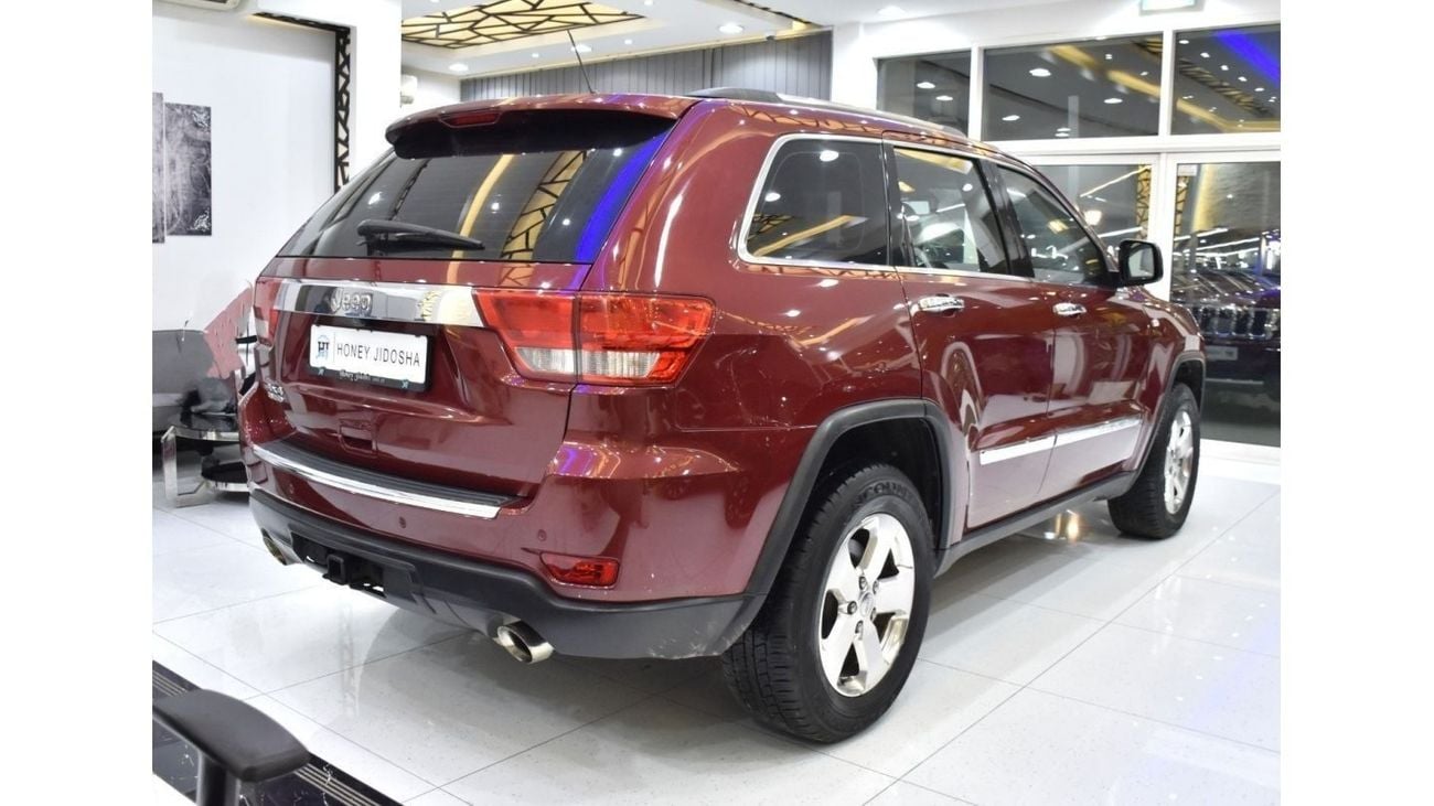 Jeep Grand Cherokee EXCELLENT DEAL for our Jeep Grand Cherokee Limited 4x4 ( 2013 Model ) in Red Color GCC Specs