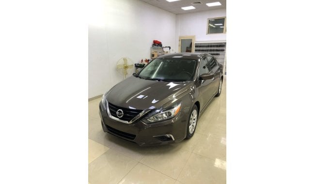 Nissan Altima Nissan altima clean and neat car for sale In Sharjah haraj showroom Number 327 for further informati