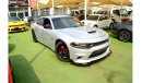 Dodge Charger R/T The Charger RT is powered by a 5.7-liter HEMI V8 engine that produces 370 horsepower and 535 Nm