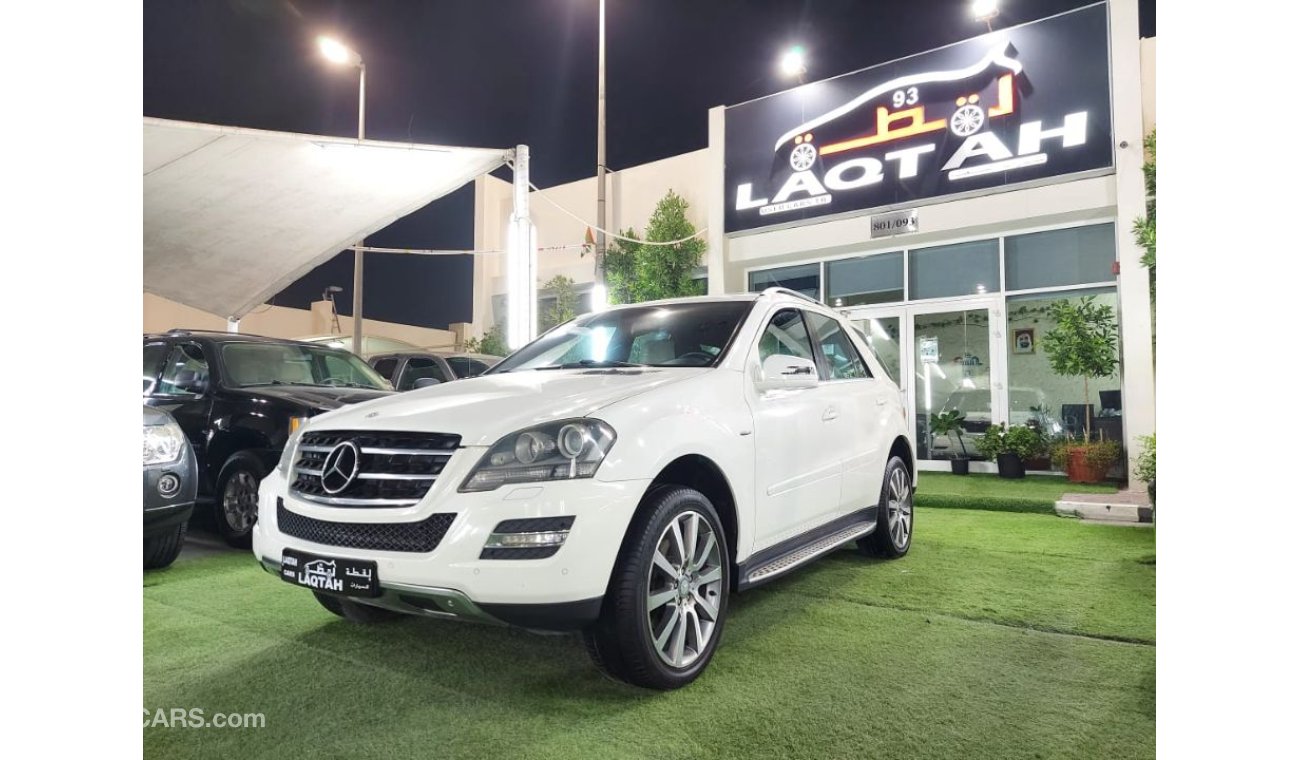 مرسيدس بنز ML 350 خليجي موديل 2011 لون ابيض داخل بيج رقم واحد فتحه جلد رنجات حساسات شاشه كاميرا بحاله ممتازه