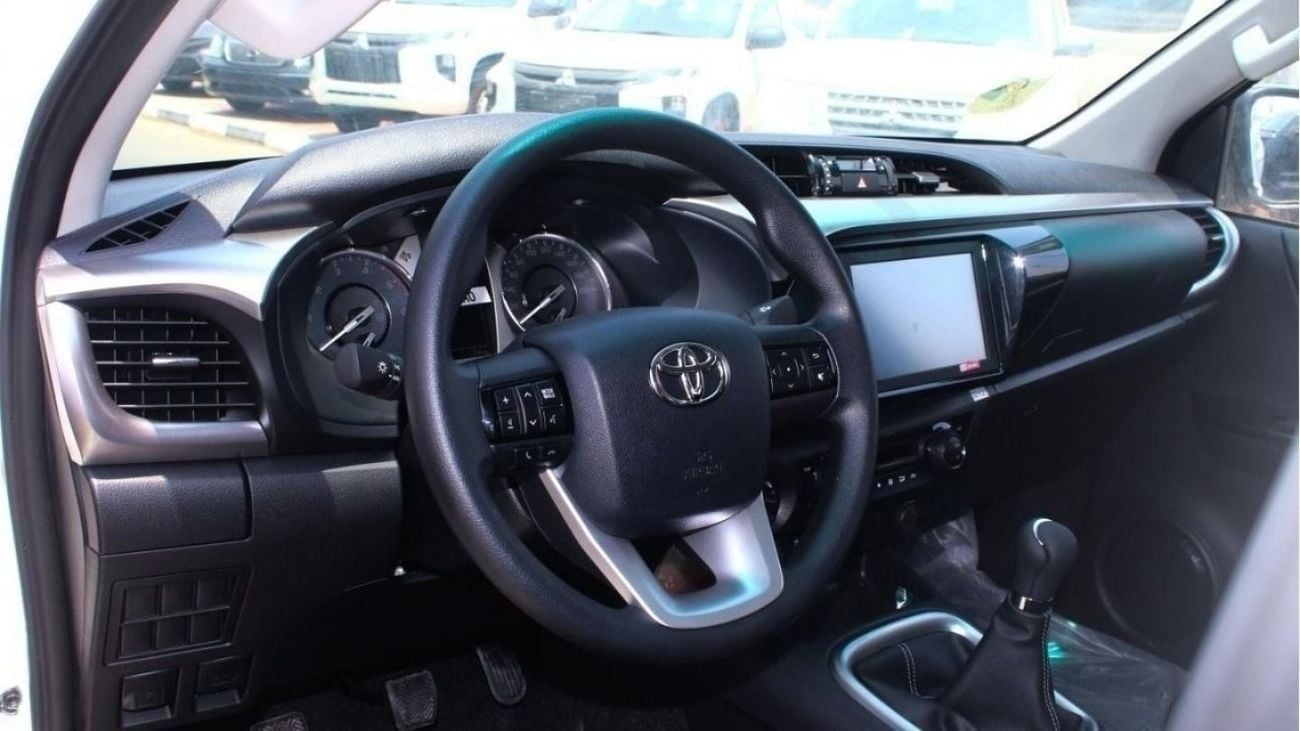 Toyota Hilux 2.4L diesel  . White 2025 model, M/T Wide body with Chrome bumper