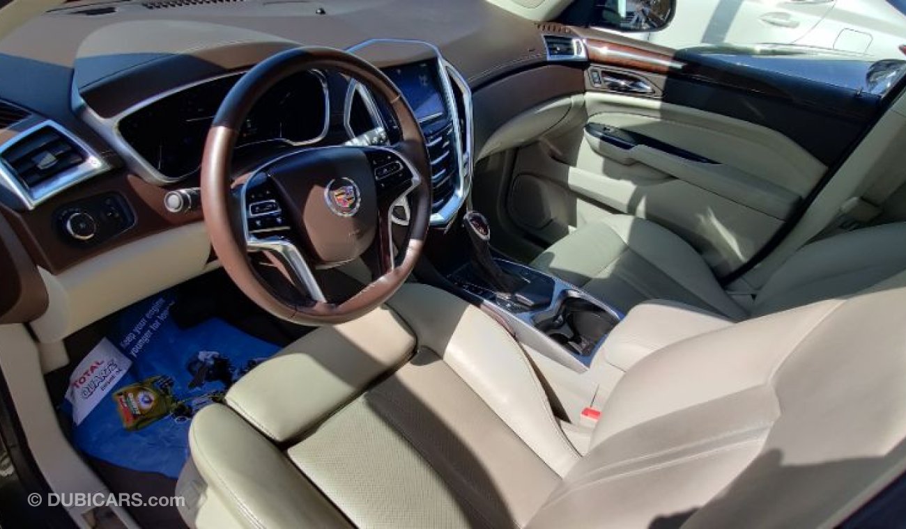 كاديلاك SRX 2014 model GCC specs full options panorama clean car 3.6ltr