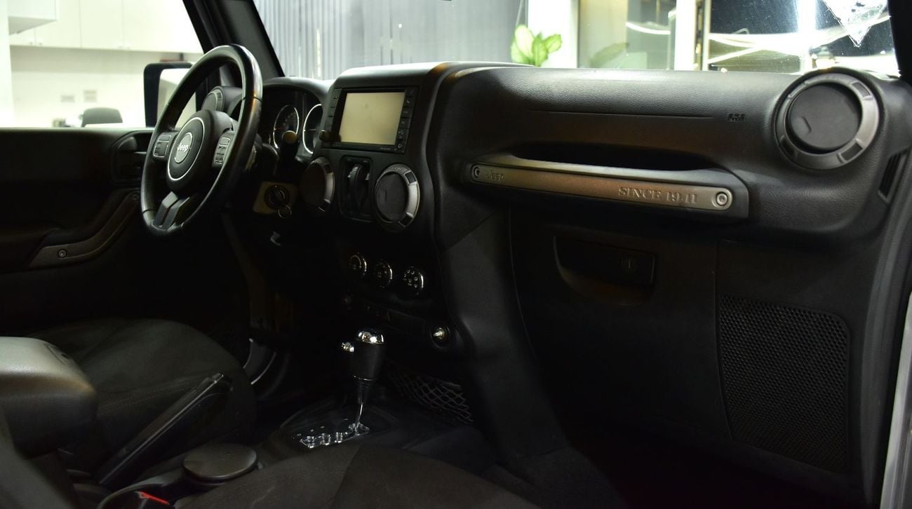 Jeep Wrangler EXCELLENT DEAL for our Jeep Wrangler Sport ( 2016 Model ) in Silver Color GCC Specs