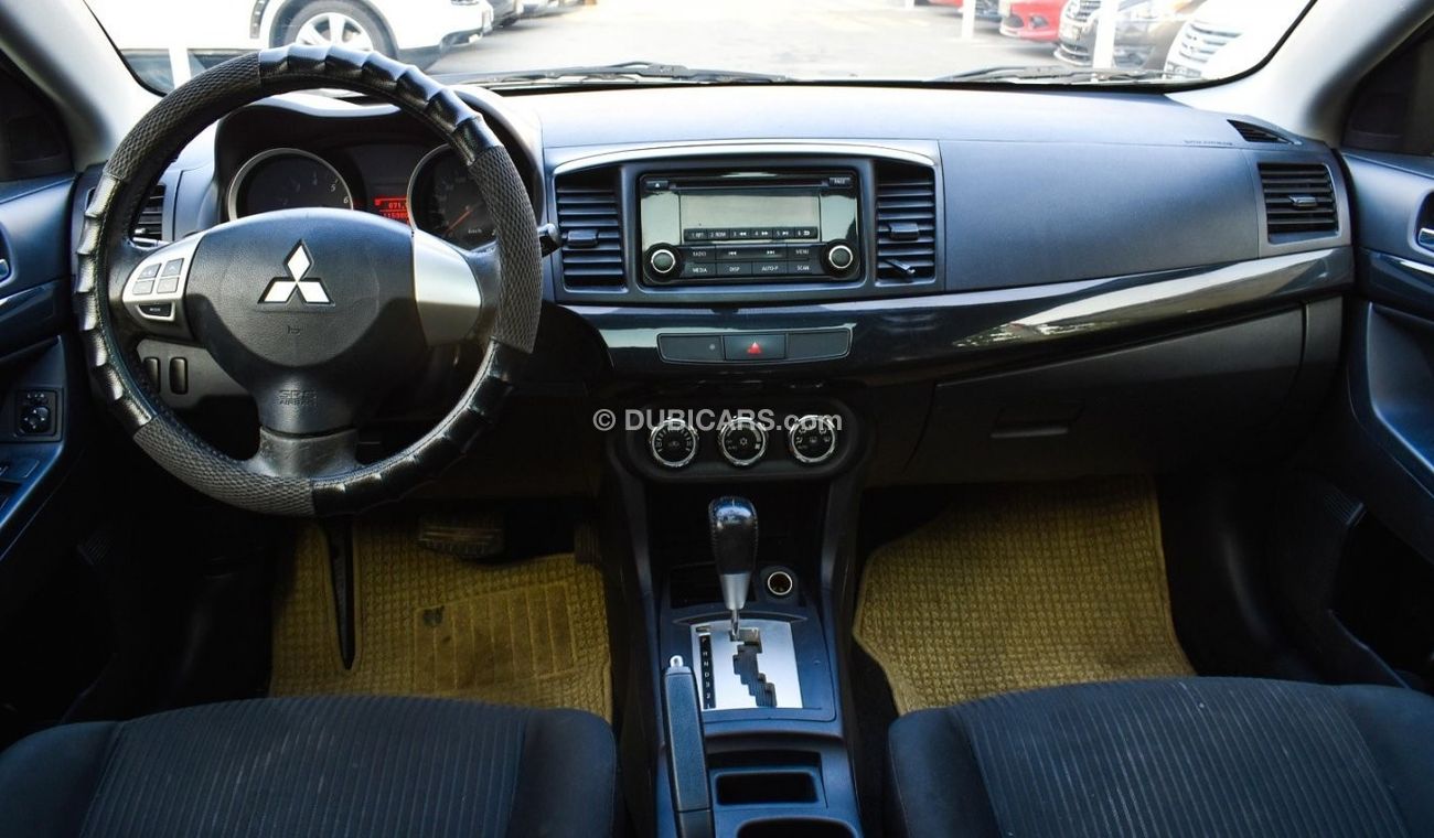 Mitsubishi Lancer 1600 CC, 2016 model, Gulf silver color, rear wing hatch, alloy wheels, FM radio, power conditioning,