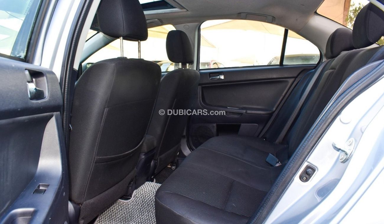 Mitsubishi Lancer 1600 CC, 2016 model, Gulf silver color, rear wing hatch, alloy wheels, FM radio, power conditioning,