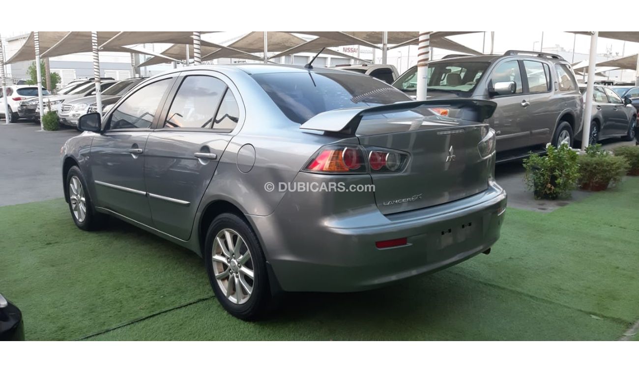 Mitsubishi Lancer Gulf gray color inside beige without accidents Rings rear wing sensors fog lights in excellent condi