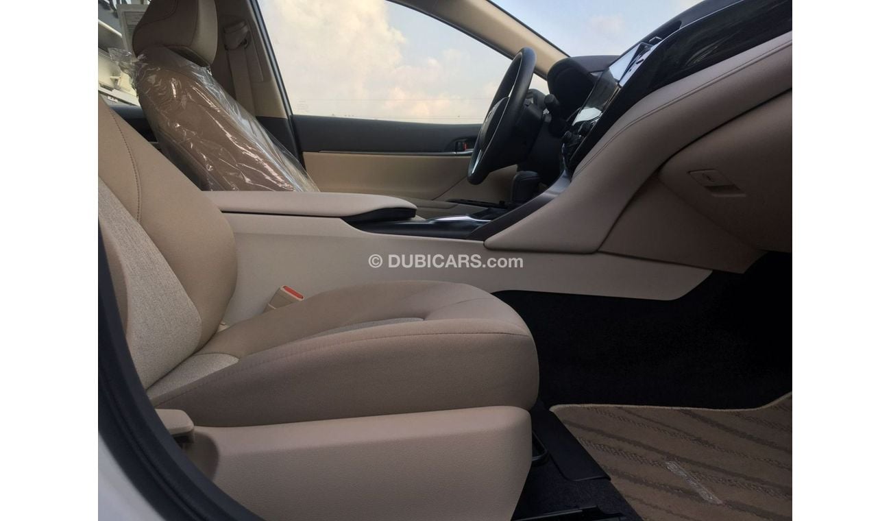 تويوتا كامري LE تويوتا كامري LE (AXVH71) 2.5 لتر سيدان هجين دفع أمامي 4 أبواب لون أبيض 2020 موديل دفع بدء ناقل حر