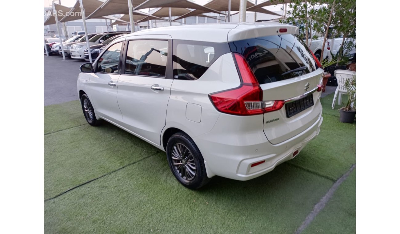 Suzuki Ertiga Gulf model 2019, agency dye, 1600 cc, imprint, white color, rear wing, alloy wheels, air conditionin