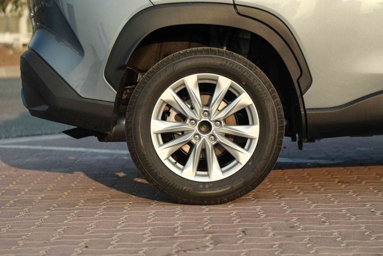 تويوتا كورولا كروس 2024 TOYOTA COROLLA CROSS 1.8 Hybrid MID - Celestite Gray Me inside RED | Export Only