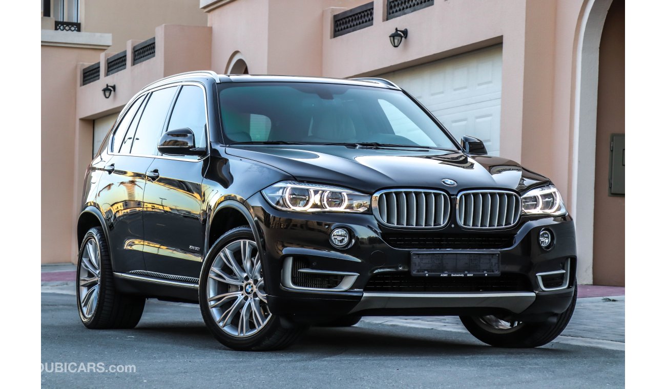BMW X5 X-Drive 50i 2014 GCC under Agency Warranty & Service contract with Zero Down-Payment.