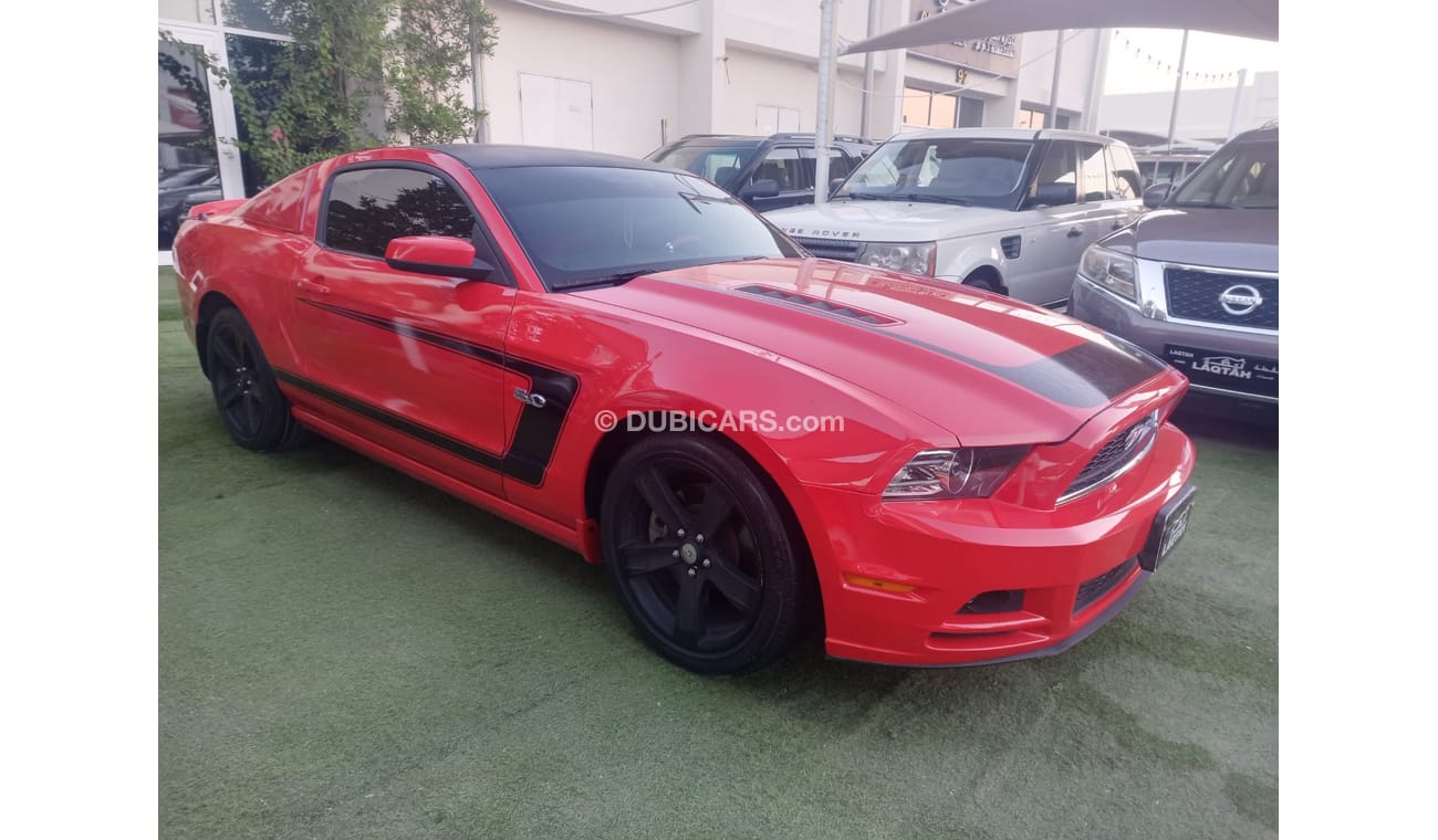Ford Mustang 2014 GCC model, coupe, cruise control, rear camera, leather rear spoiler, in excellent condition