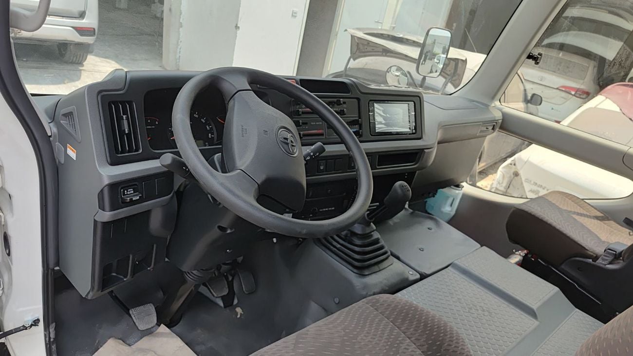 Toyota Coaster 4.0L ECTTAE004 - 2026 Toyota Coaster - 4.0L Diesel Manual – 23 Seats, Auto Door, 3PSB, Mic, Baggage Rack