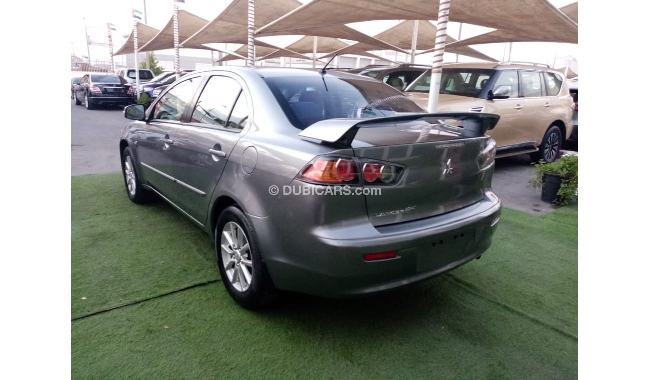 Mitsubishi Lancer Gulf gray color, inside beige without accidents, rear wing sensors, fog lights, in excellent conditi
