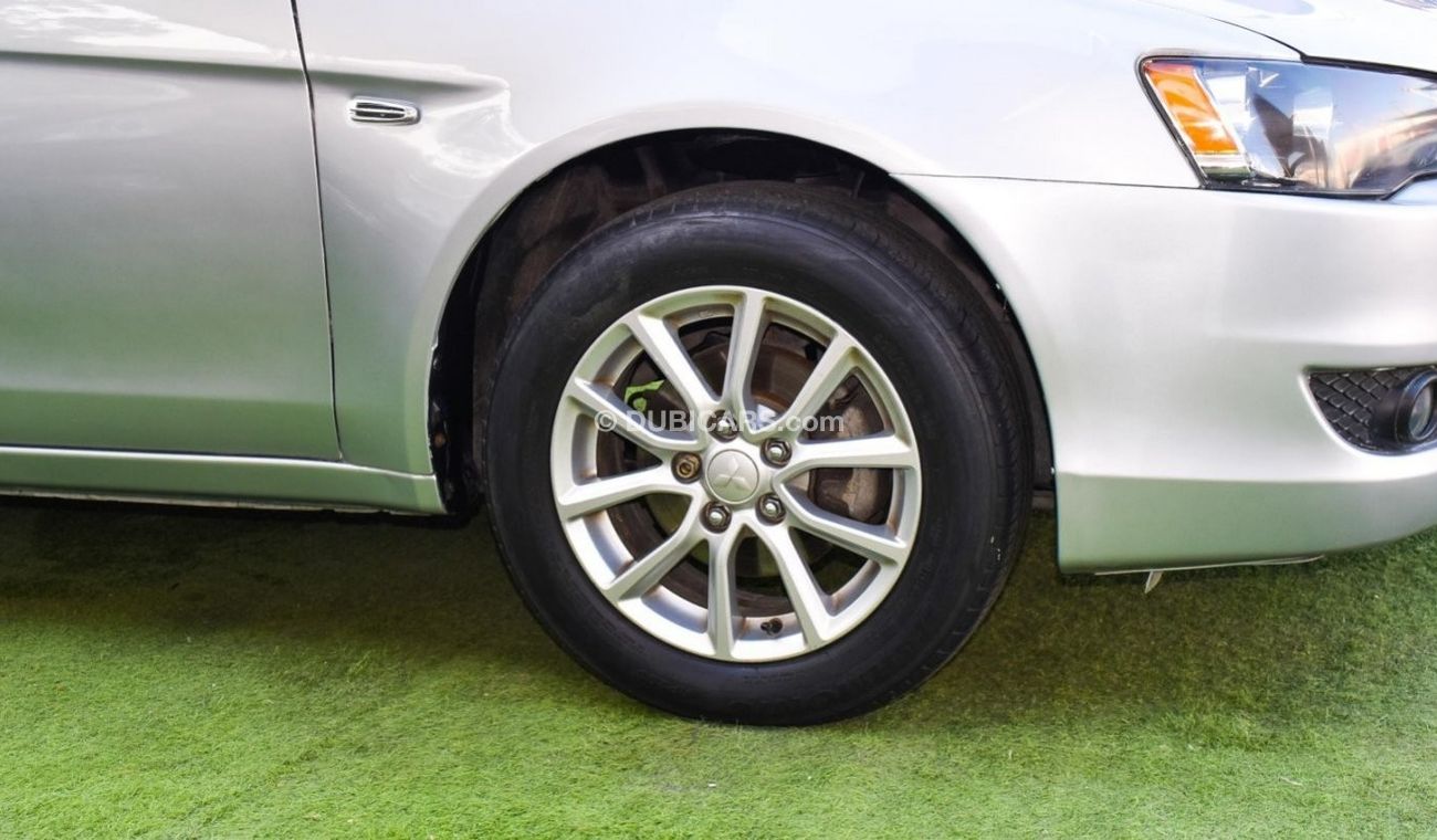 Mitsubishi Lancer 1600 CC, 2016 model, Gulf silver color, rear wing hatch, alloy wheels, FM radio, power conditioning,