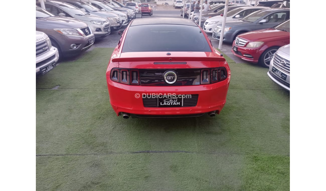 Ford Mustang 2014 GCC model, coupe, cruise control, rear camera, leather rear spoiler, in excellent condition