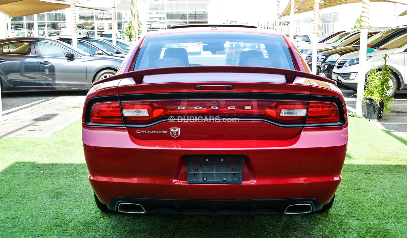 Dodge Charger Import - number one - manhole - leather - rear spoiler - cruise control - wheels - sensors in excell