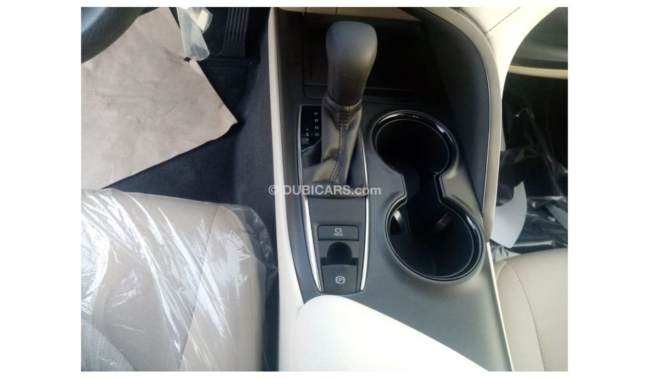 Toyota Camry LE 2022  White inside beige 2.5L petrol 4 Cylinder