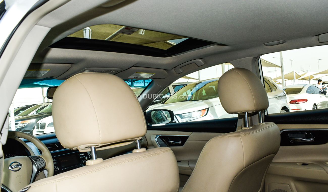 Nissan Altima White color inside Big Ward No.1 fingerprint slot, leather alloy wheels, camera screen control senso