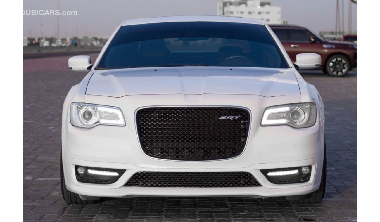 Chrysler 300C SRT8 Chrysler 300 SRT Model : 2015 Mileage : 197,000 km Price : 65,000 dirhams Gulf specifications ,