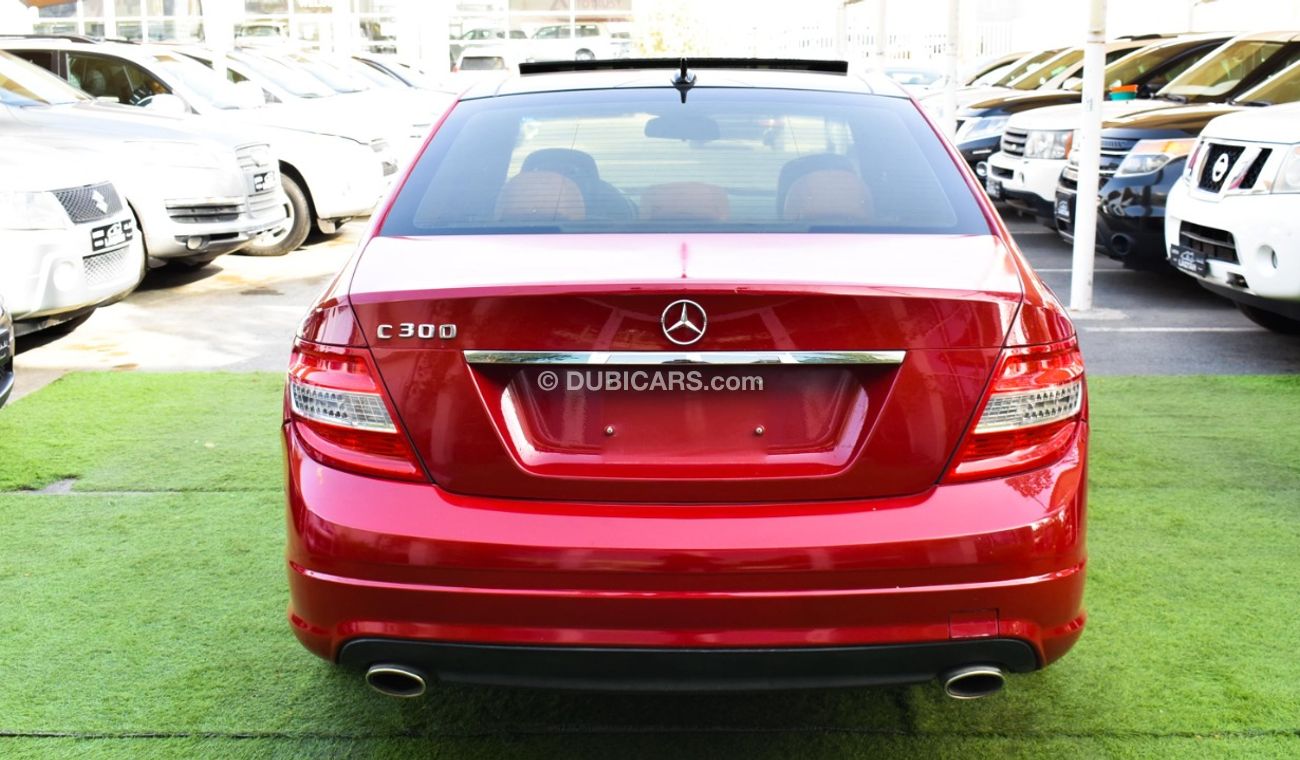 Mercedes-Benz C 300 2009 model, red color, number one, panorama, leather, cruise control, sensor wheels, in excellent co