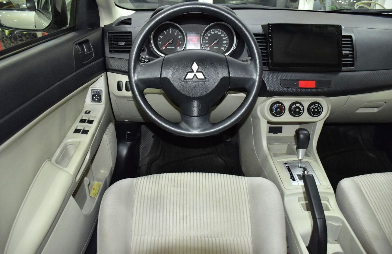 Mitsubishi Lancer EX EXCELLENT DEAL for our Mitsubishi Lancer EX ( 2015 Model ) in Beige / Silver Color GCC Specs