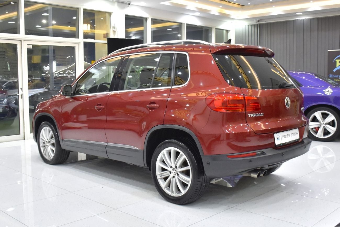 Volkswagen Tiguan SEL EXCELLENT DEAL for our Volkswagen Tiguan 2.0 TSi 4Motion ( 2014 Model ) in Red Color GCC Specs