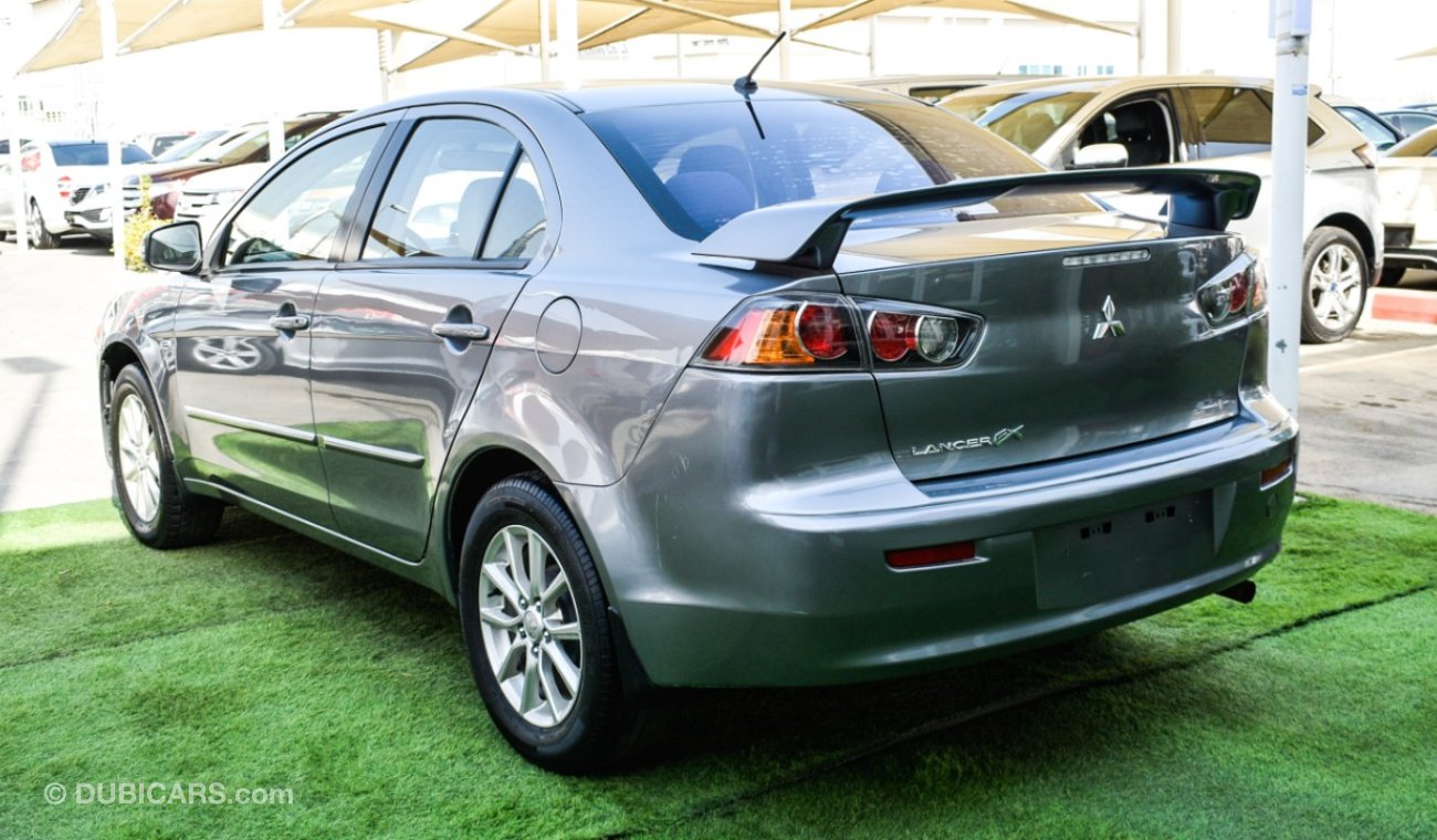 Mitsubishi Lancer Gulf gray color inside beige without accidents Rings rear wing sensors fog lights in excellent condi