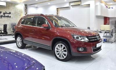 Volkswagen Tiguan SEL EXCELLENT DEAL for our Volkswagen Tiguan 2.0 TSi 4Motion ( 2014 Model ) in Red Color GCC Specs