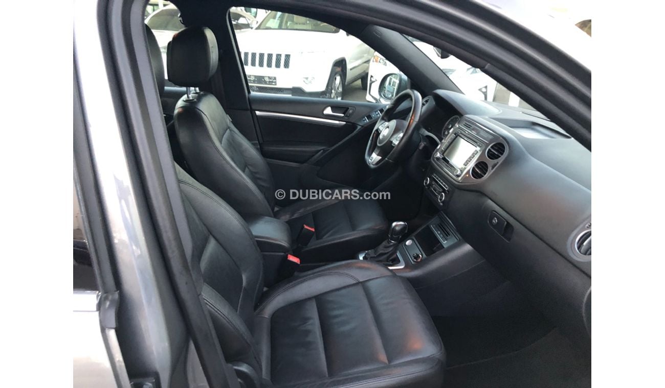 فولكس واجن تيجوان تيجوان R موديل 2014 خليجي فل مواصفات كراسي جلد ومثبت سرعه وتحكم كهربي كامل ونظام صوت ممتاز وكاميرا خ