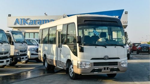 Toyota Coaster 4.2L V6 M/T Diesel 23 passengers - 16″ wheels - brown interior