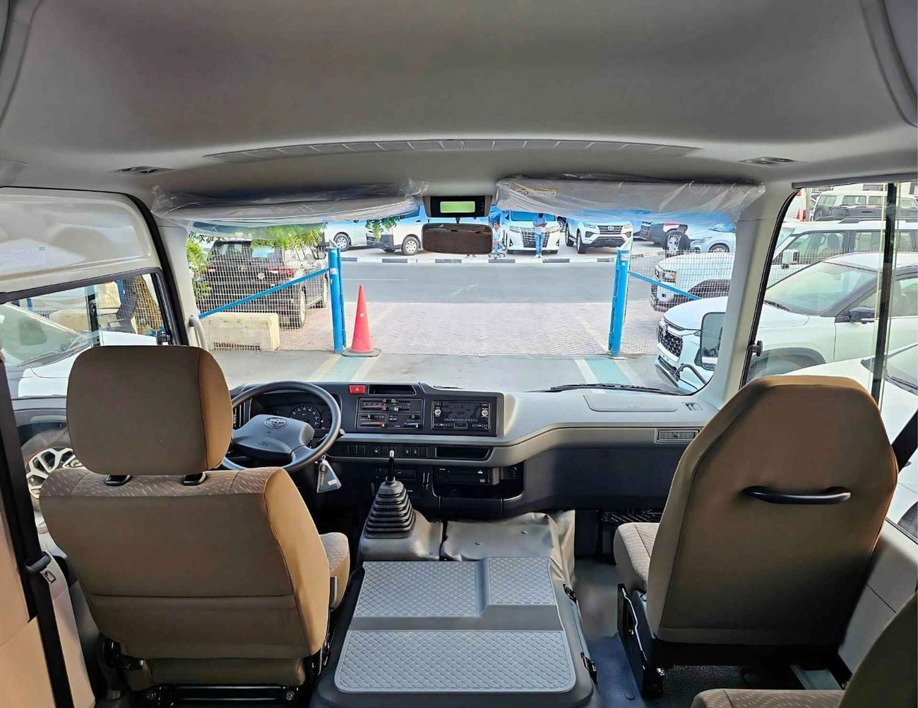 Toyota Coaster 2.7L PETROL M/T DUAL TONE || 23 SEATER | AUTO DOOR | HLF LUGGAGE RACK (CODE # COPB)