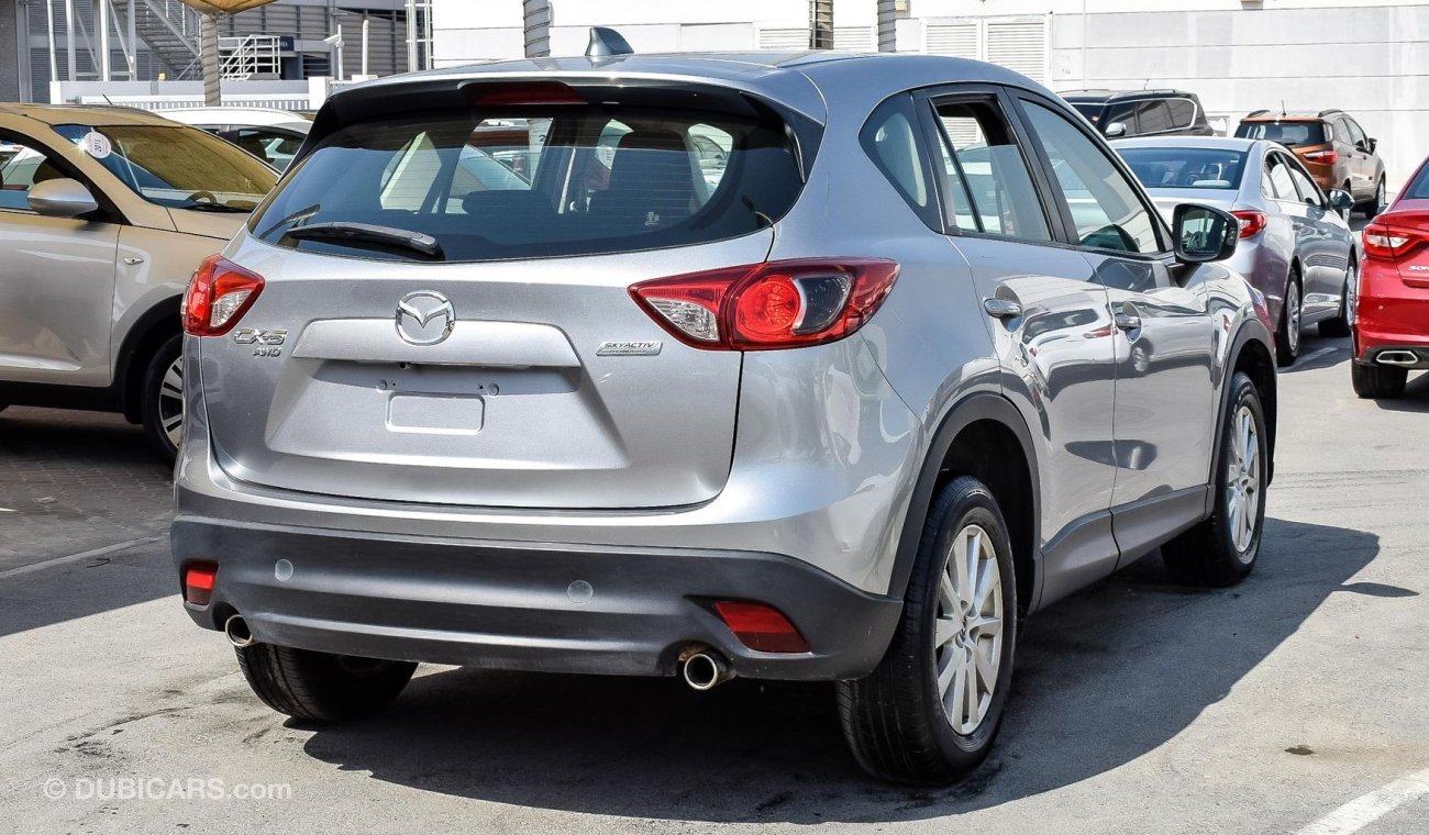 Mazda CX-5 Pre-owned Mazda CX-5 AWD for sale in Sharjah. Grey/Silver 2014 model, available at Wael Al Azzazi Sh