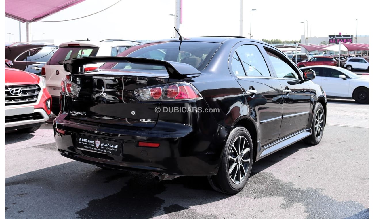 ميتسوبيشي لانسر GLS هاي خالية من الحوادث - خليجي - مكينة 2000 سي سي - رقم واحد - السيارة بحالة ممتازة من الداخل والخ