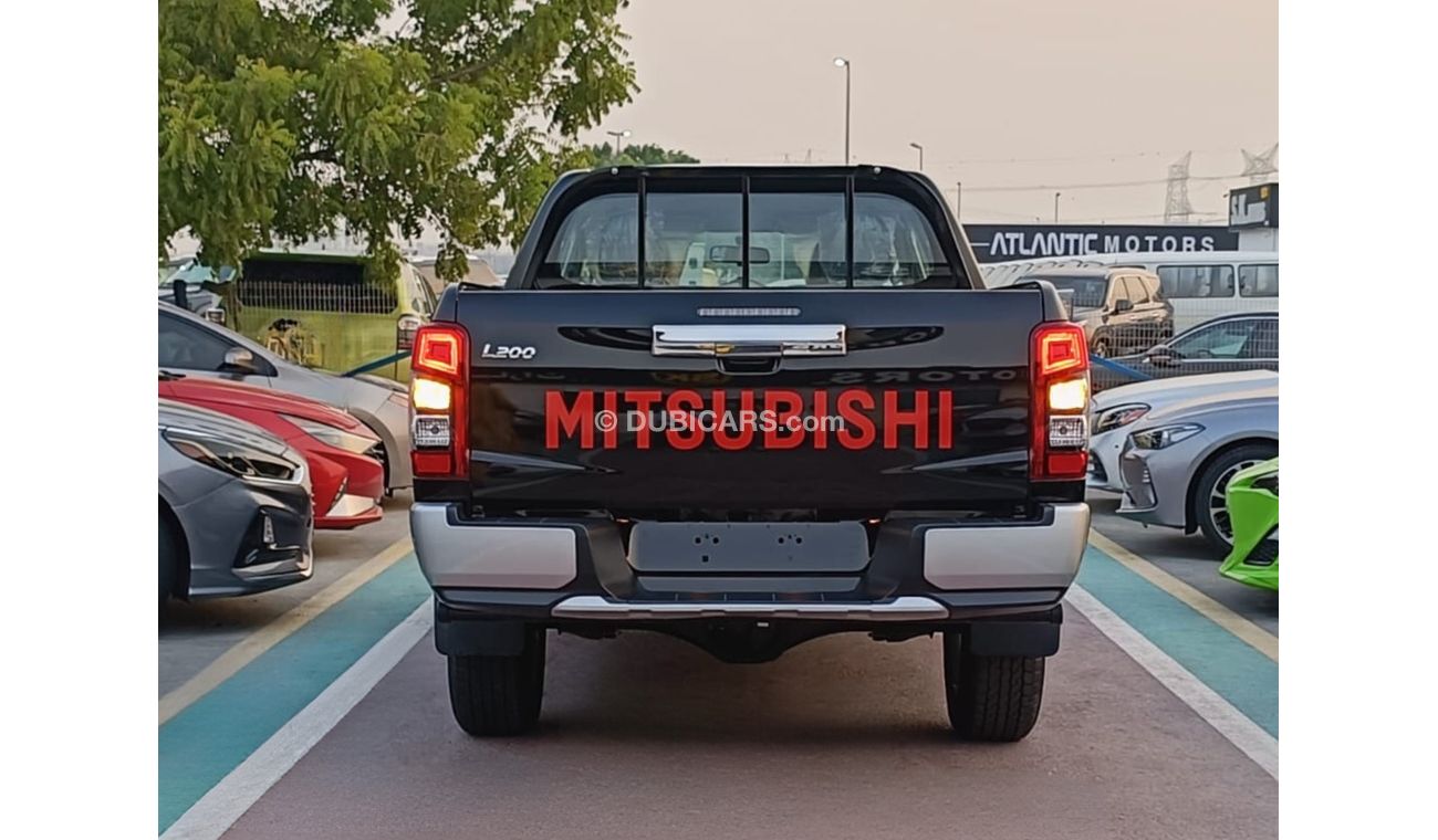 Mitsubishi L200 GLX 2.5L Diesel / M/T / 4WD / Black Rims / Steering Vol Control (Code # L2DDB)