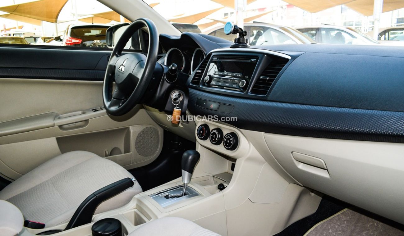 Mitsubishi Lancer Gulf gray color inside beige without accidents Rings rear wing sensors fog lights in excellent condi