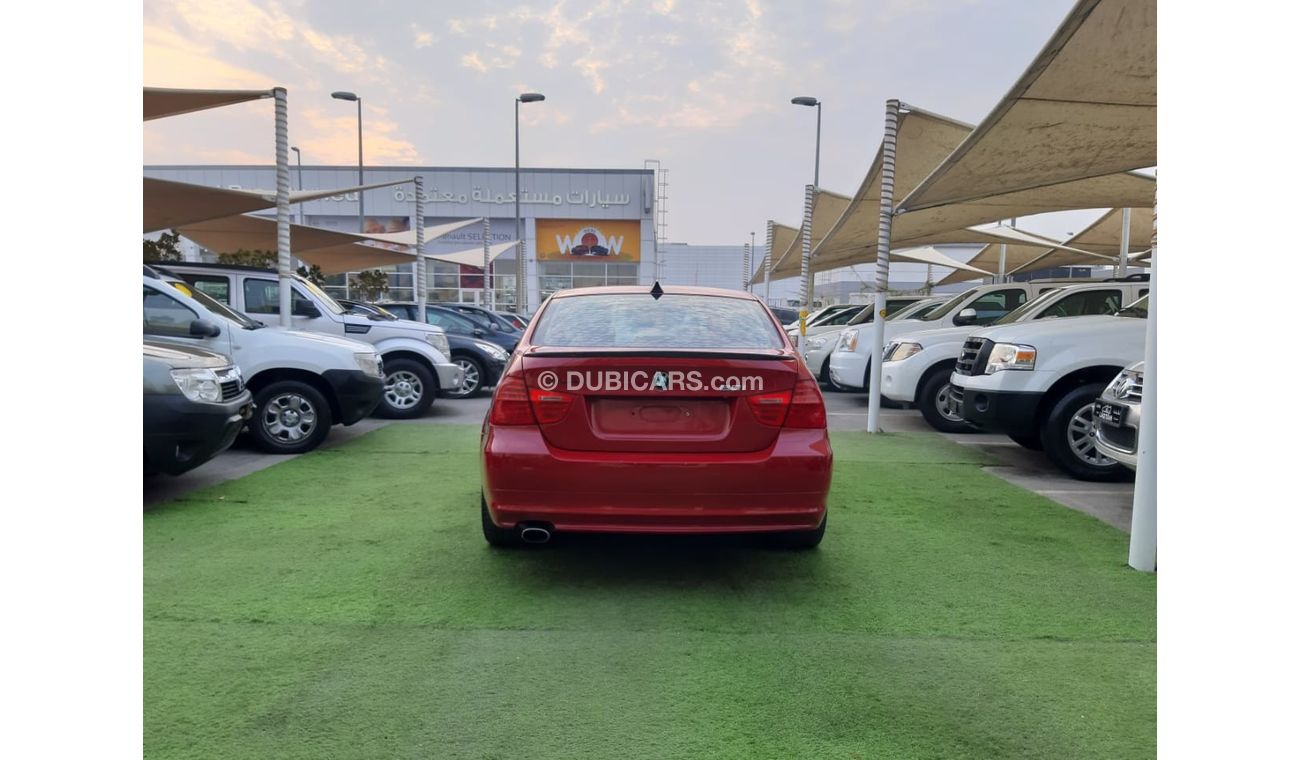 BMW 320i i Gulf Specs Red Color 2009 model in good condition