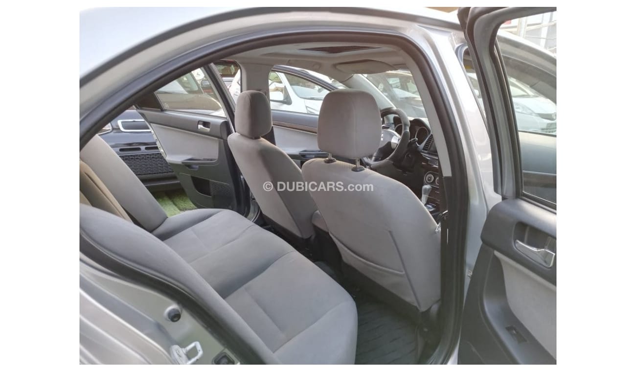 ميتسوبيشي لانسر 1600سى سى موديل 2009 خليجى فل أوبشن  خشب فتحة شاشة كاميرا خلفية بحالة ممتازة