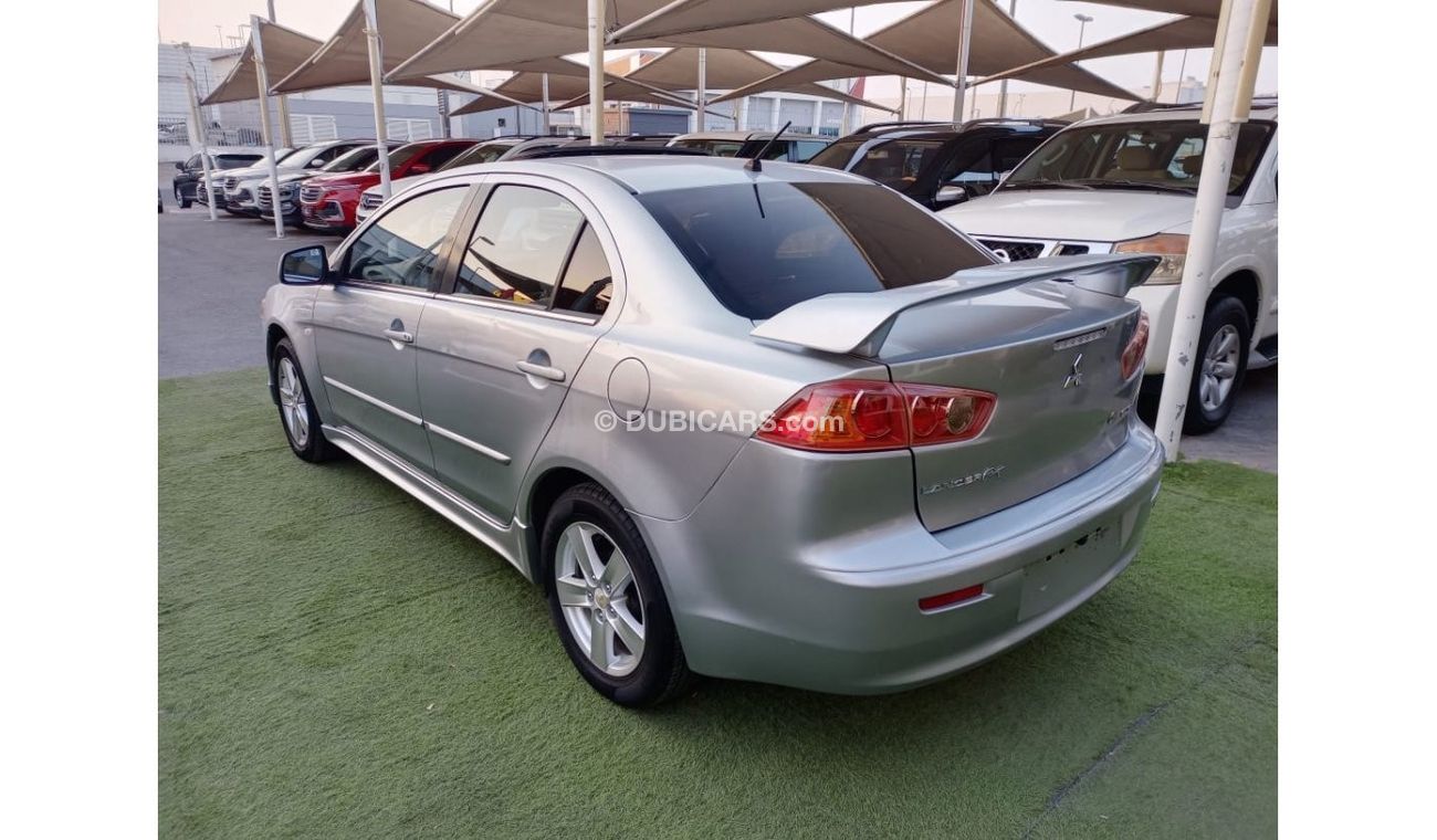 ميتسوبيشي لانسر 1600سى سى موديل 2009 خليجى فل أوبشن  خشب فتحة شاشة كاميرا خلفية بحالة ممتازة