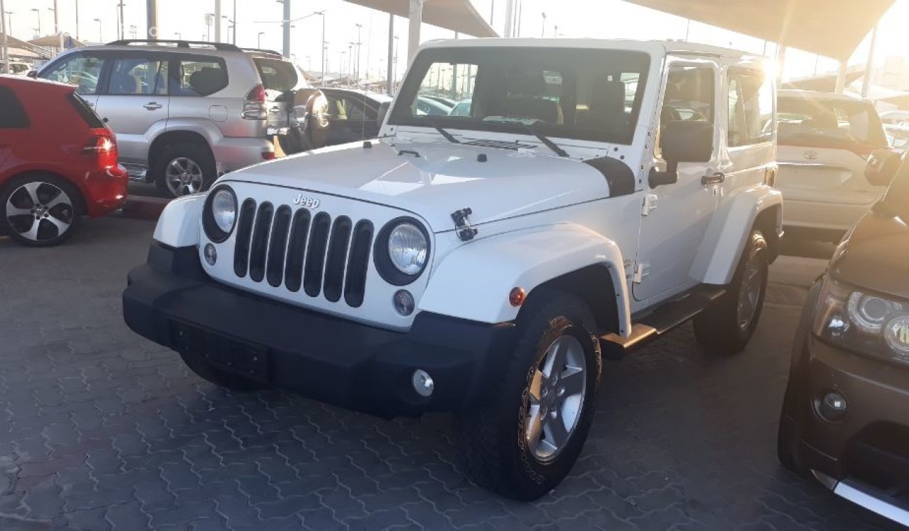 Jeep Wrangler 2013 Sahara Sport edition  Gulf specs Low mileage clean car new tyers Full service Agency