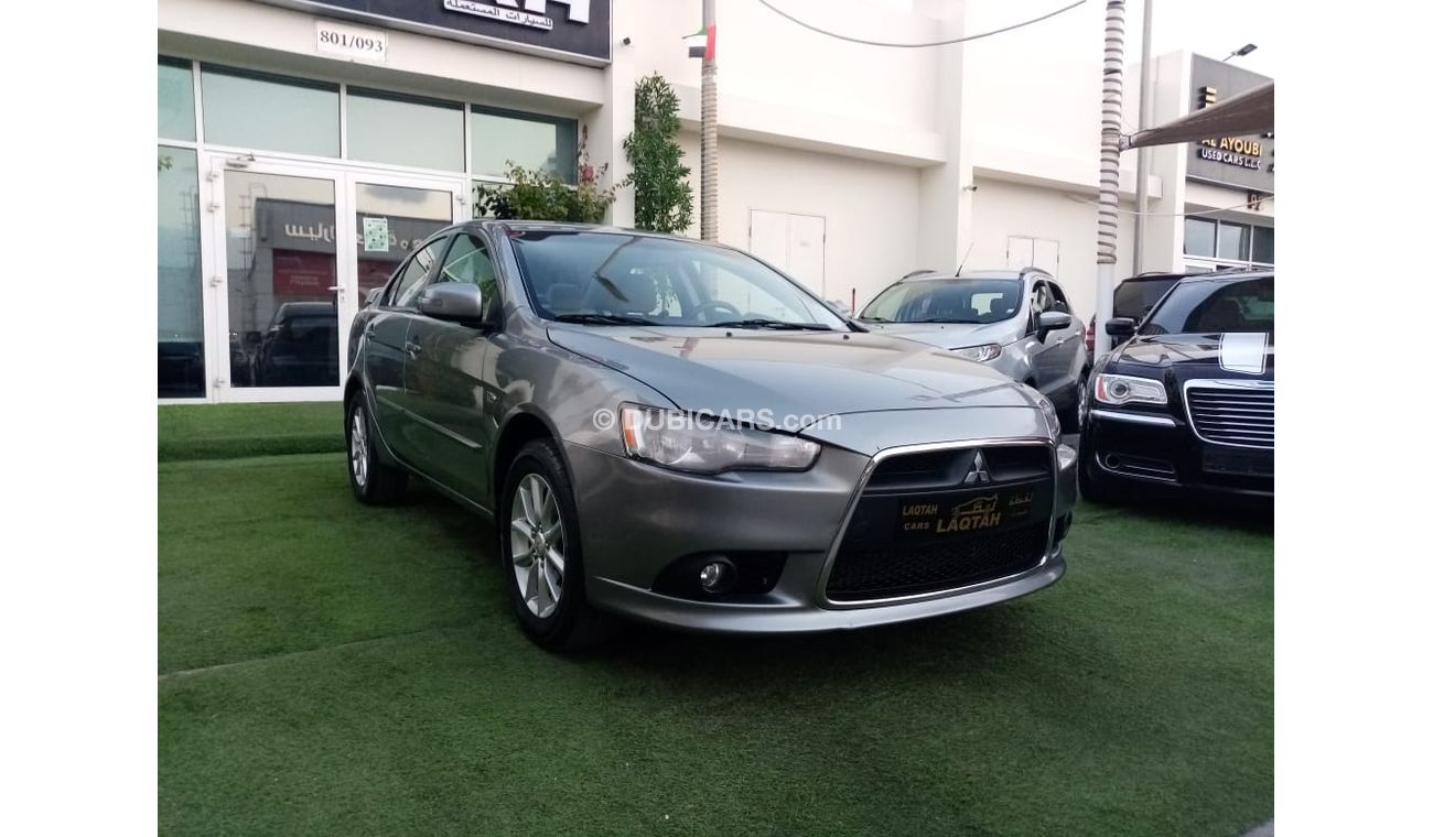 Mitsubishi Lancer Gulf gray color, inside beige without accidents, rear wing sensors, fog lights, in excellent conditi