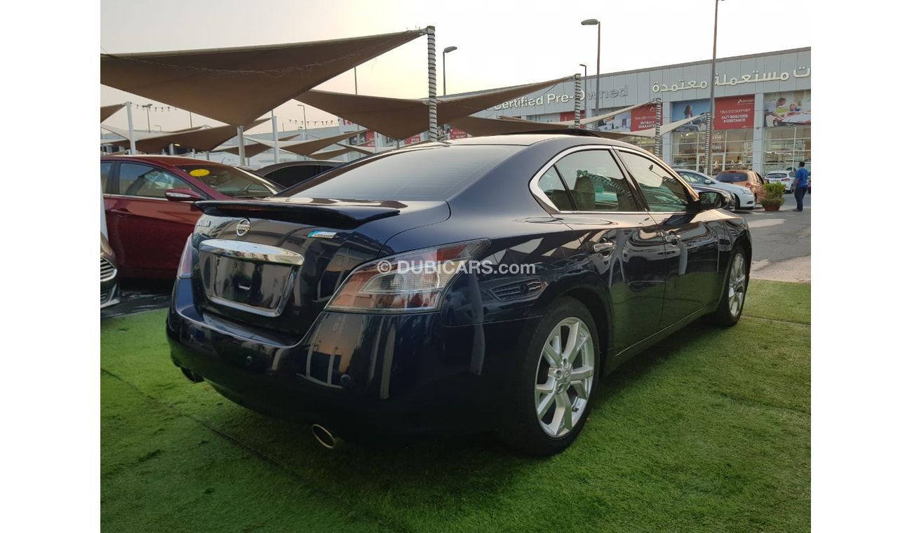 Nissan Maxima GCC Number One - Full Option - sunroof - Leather - Back Wing - Screen - Sensors -Excellent condition