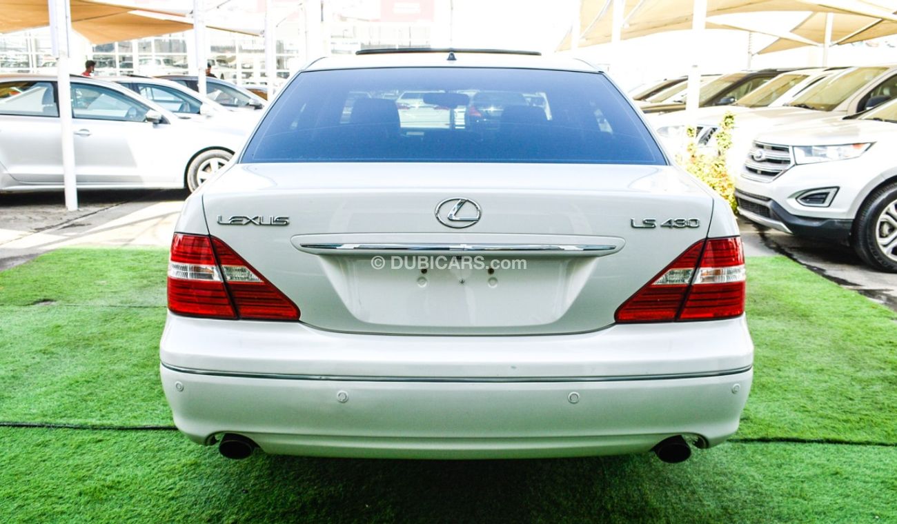Lexus LS430 Imported 1/2 Ultra 2006 model, white color, leather opening, wooden wheels, electric mirrors, electr