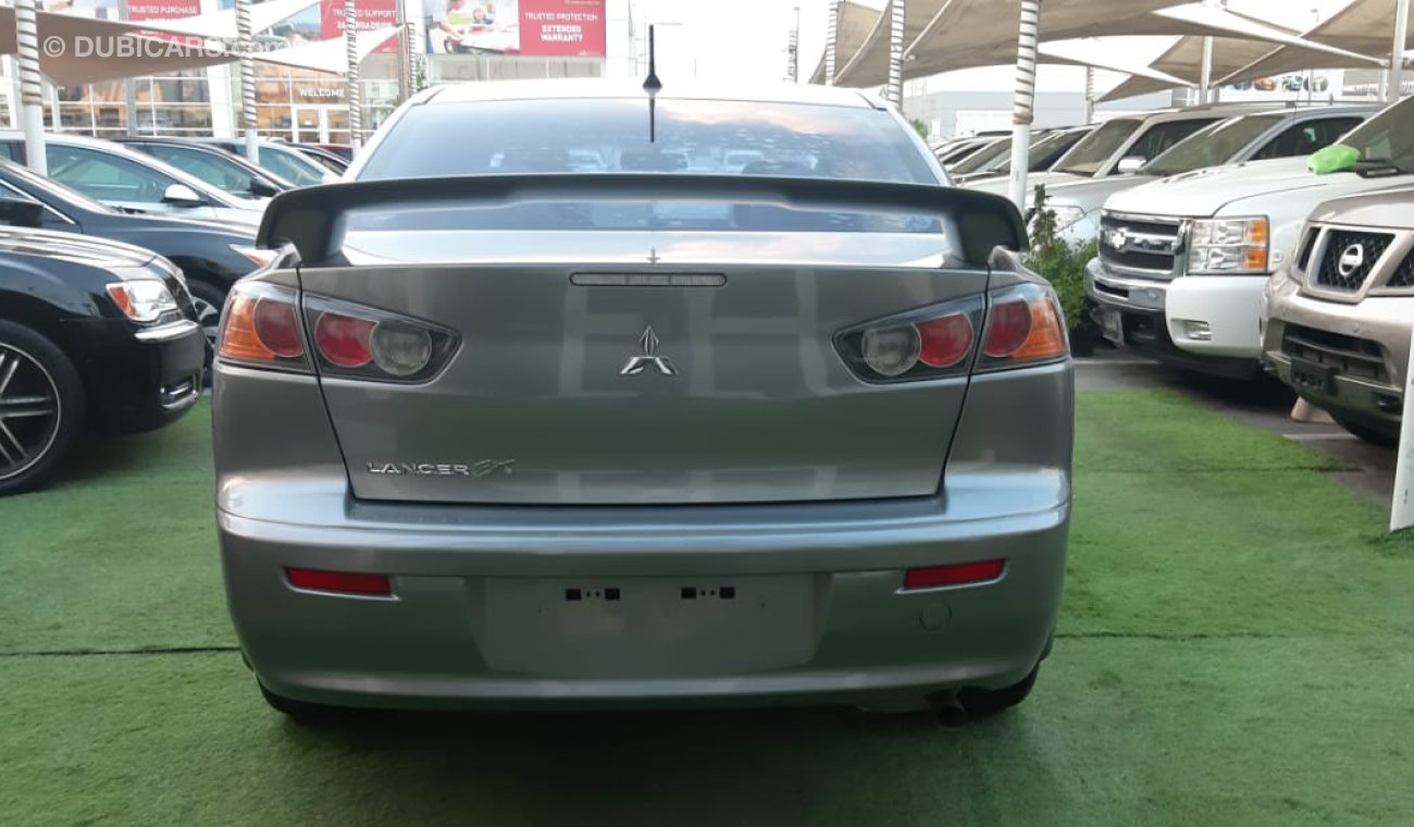 Mitsubishi Lancer Mitsubishi Lancer Gulf 2015 model gray color inside beige without accidents alloy wheels rear wing s