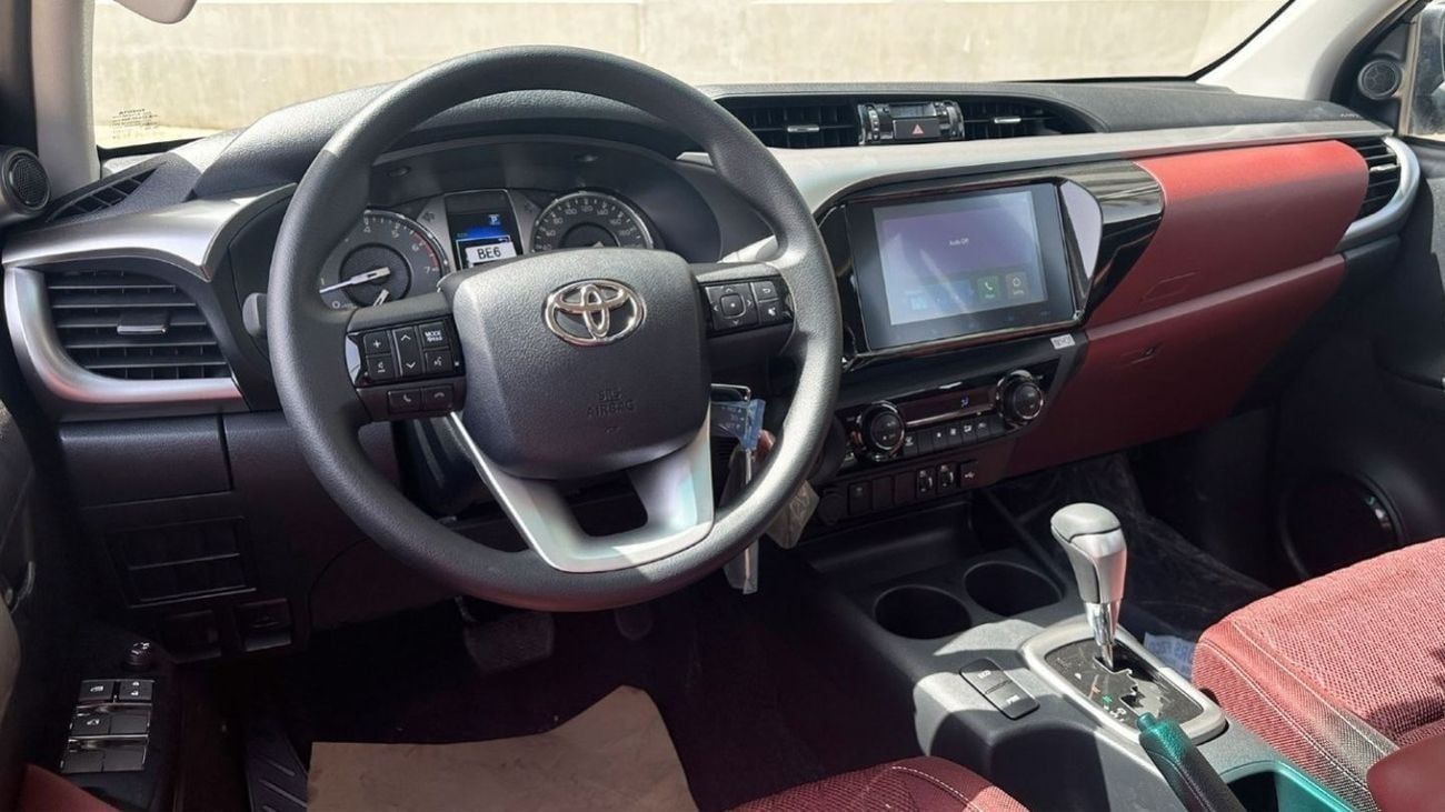 Toyota Hilux 2.7L V4  4*4 Automatic • Black Rims & Red Interior
