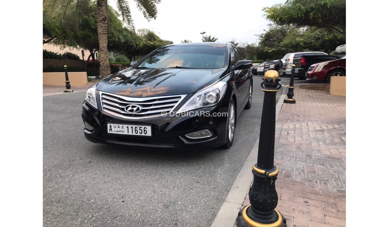 هيونداي أزيرا هيونداي ازيرا موديل 2013 خليجي صبغه وكاله فل اوبشن  بانوراما مثبت سرعه زكي كراسي جلد تبريد وتسخين