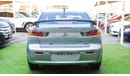 Mitsubishi Lancer 1600 CC, 2016 model, Gulf silver color, rear wing hatch, alloy wheels, FM radio, power conditioning,