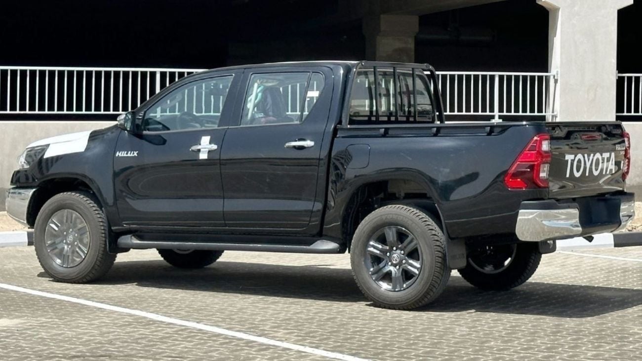 Toyota Hilux 2.7L V4  4*4 Automatic • Black Rims & Red Interior