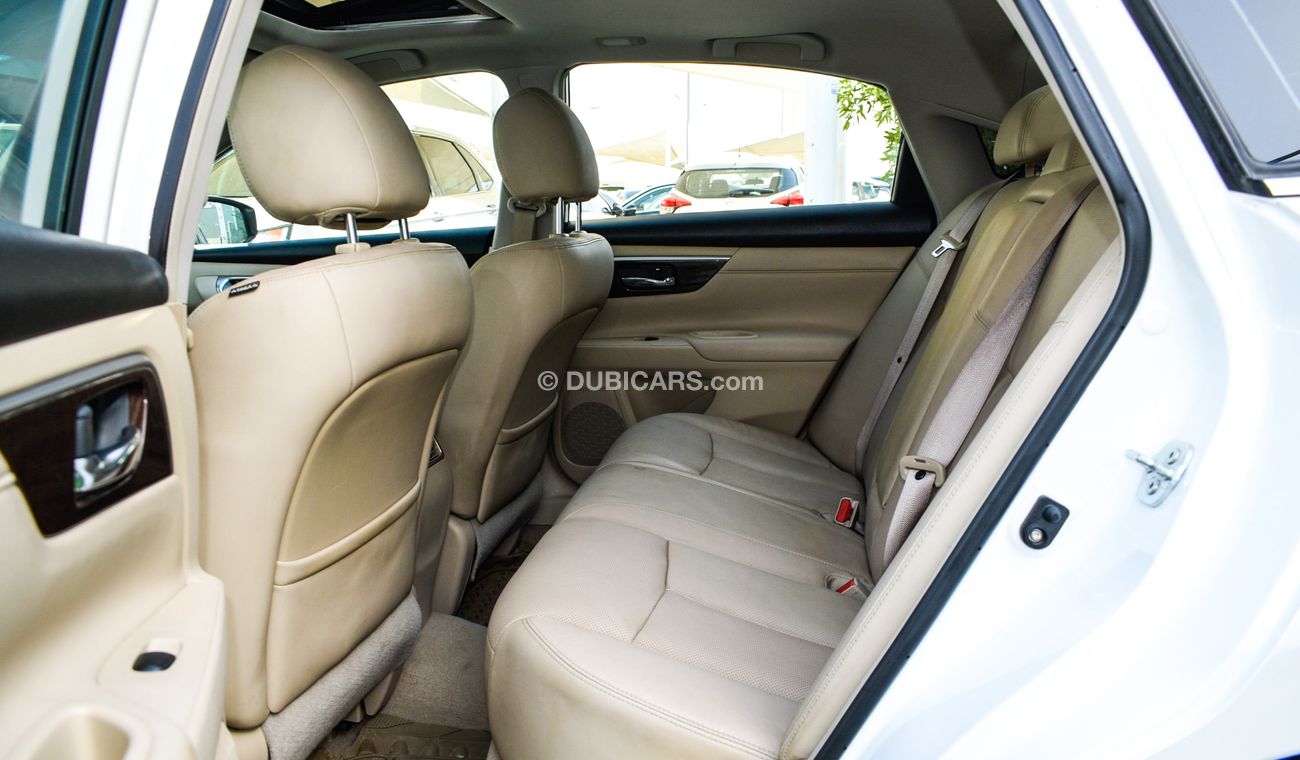 Nissan Altima White color inside Big Ward No.1 fingerprint slot, leather alloy wheels, camera screen control senso