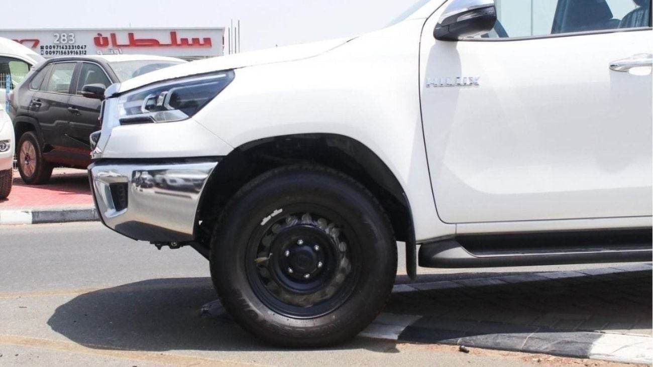 Toyota Hilux 2.4L diesel  . White 2025 model, M/T Wide body with Chrome bumper