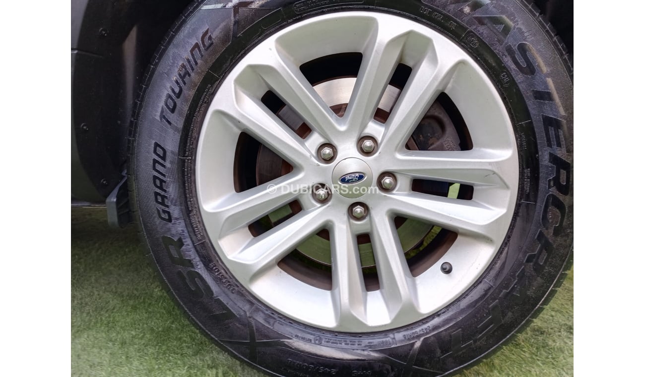 Ford Explorer 2014 model GCC, camera screen, cruise control, wheels, sensors, rear spoiler, in excellent condition